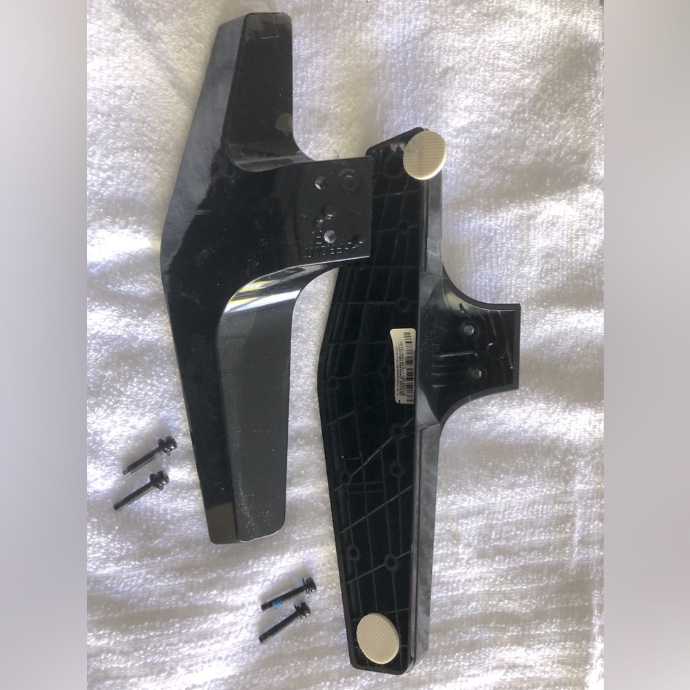 Pair black TV feet, never used.